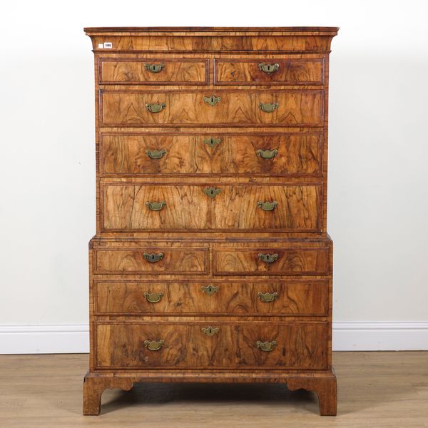 A GEORGE II EBONY BANDED FIGURED WALNUT CHEST ON CHEST