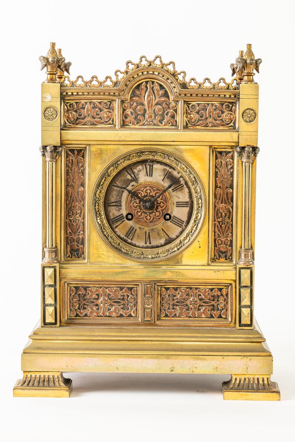 A FRENCH BRASS MANTEL CLOCK