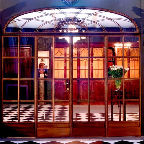 A SET OF BRONZE PATINATED CAST IRON ORANGERY/FRENCH WINDOWS