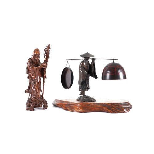 A JAPANESE BRONZE FIGURE CARRYING A BELL AND GONG (2)