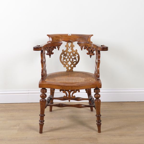 A VICTORIAN CARVED FRUITWOOD DESK CHAIR