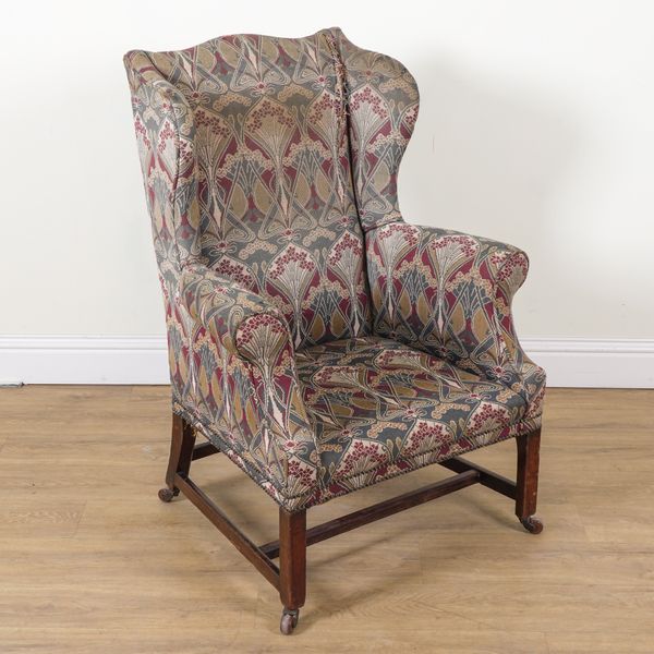 AN 18TH CENTURY MAHOGANY FRAMED WINGBACK ARMCHAIR