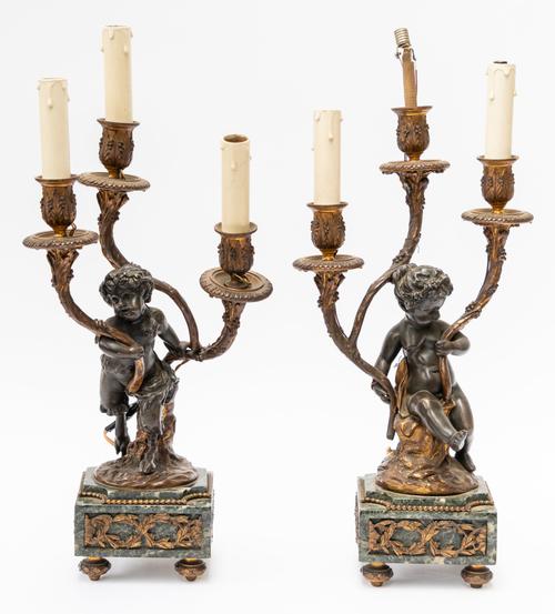 A PAIR OF FRENCH LOUIS XVI STYLE GILT AND PATINATED BRONZE THREE LIGHT CANDELABRA AFTER CLODION (2)