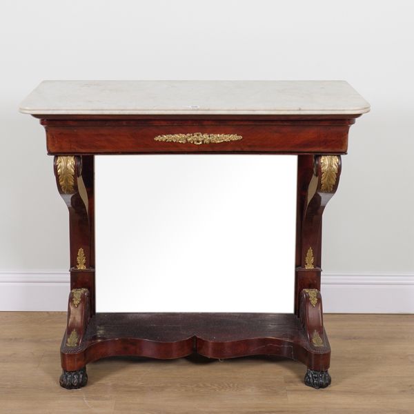 A CHARLES X MARBLE TOPPED GILT METAL MOUNTED MAHOGANY CONSOLE TABLE