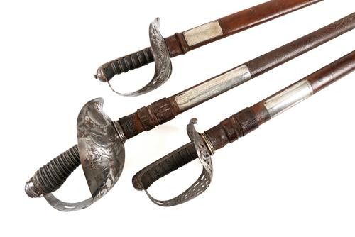 A POIGNANT FAMILY GROUP OF THREE BRITISH PRESENTATION AND DRESS SWORDS TO THE YEATHERD FAMILY