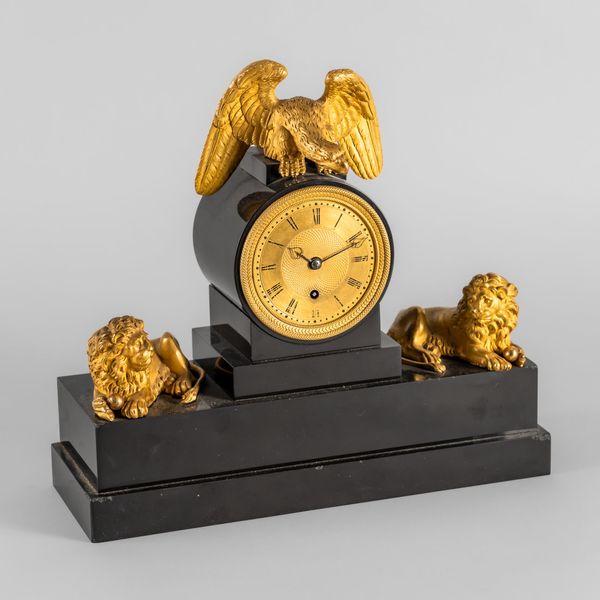 A REGENCY ORMOLU-MOUNTED BLACK MARBLE MANTEL TIMEPIECE