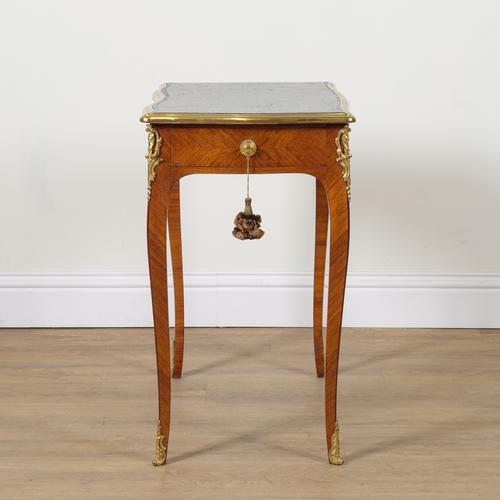 A LOUIS XV STYLE GILT METAL MOUNTED TULIPWOOD WRITING TABLE