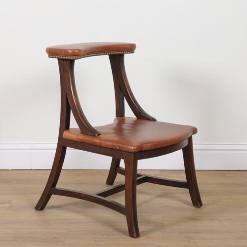 IN THE MANNER OF J.G GRACE; A STAINED BEECH FRAMED LIBRARY CHAIR