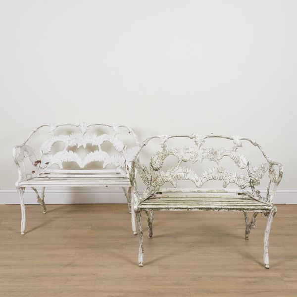 AFTER COALBROOKDALE; A PAIR OF FERN AND BERRY PATTERN WHITE PAINTED ALUMINIUM GARDEN BENCHES (2)