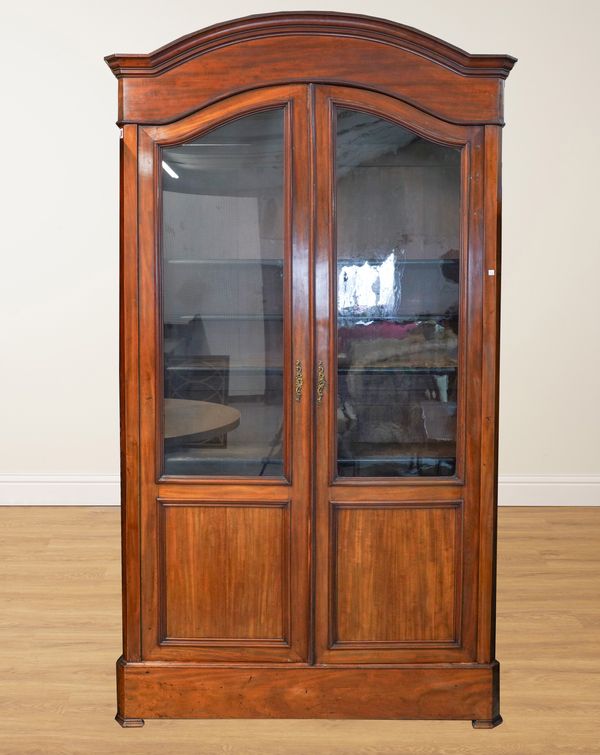 A 19TH CENTURY FRENCH MAHOGANY ARCH TOP TWO DOOR BOOKCASE