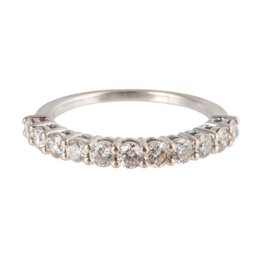 AN 18CT WHITE GOLD AND DIAMOND ELEVEN STONE HALF HOOP RING