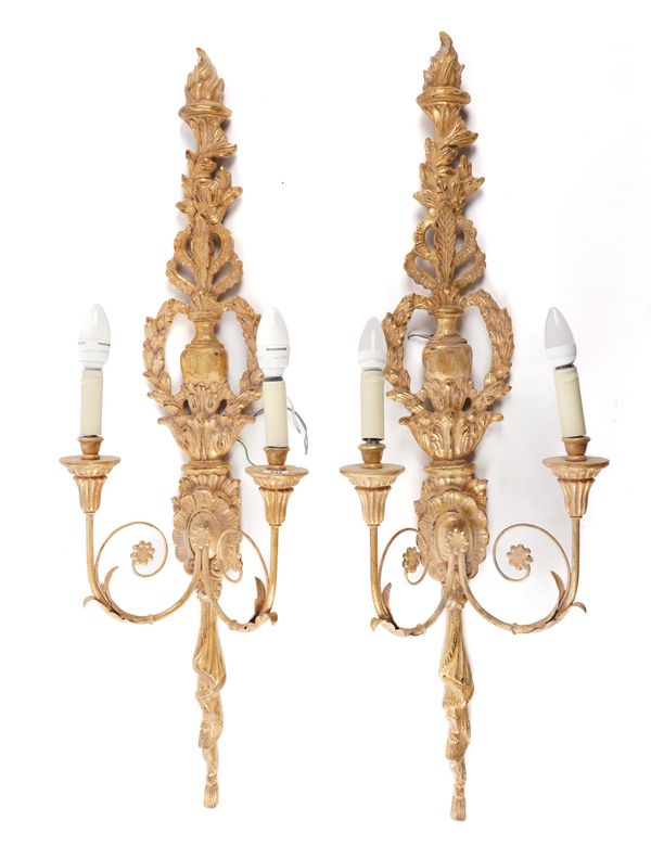 BEAUMONT & FLETCHER, A PAIR OF TALL GILT WOOD TWIN BRANCH WALL LIGHTS WITH FLAME FINIAL AND ACANTHUS DECORATION