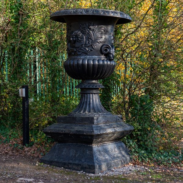 A MONUMENTAL BLACK PAINTED CAST IRON URN