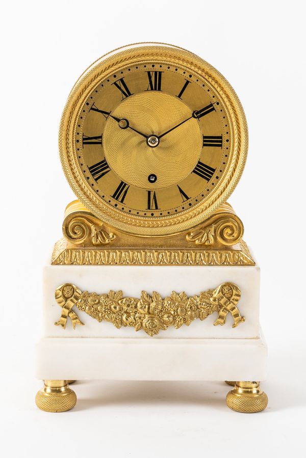 A REGENCY ORMOLU-MOUNTED WHITE MARBLE MANTEL TIMEPIECE