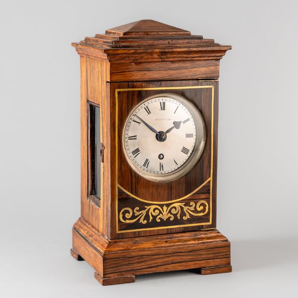 A ROSEWOOD AND BRASS-INLAID CHAMFER-TOP MINIATURE BRACKET CLOCK AND BRACKET