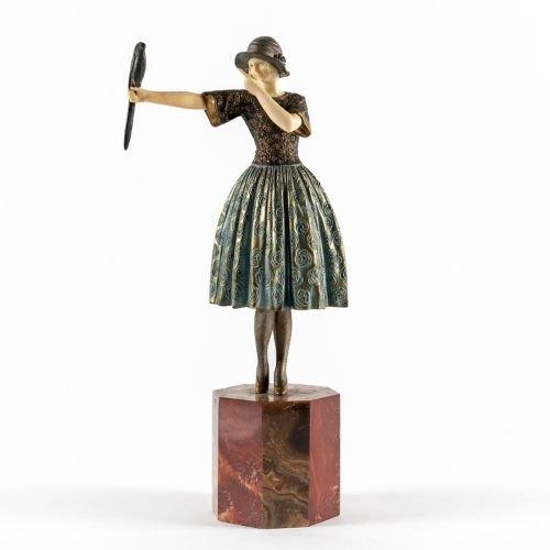 DEMETRE CHIPARUS (ROMANIAN 1886-1947): A FRENCH ART DECO COLD PAINTED BRONZE AND IVORY MODEL OF A GIRL WITH PARAKEET KNOWN AS  ‘INDISCREET’