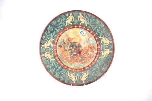 WILHELM SCHILLER & SON A MAJOLICA WALL PLATE DEPICTING A BATTLE SCENE