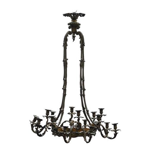 A LOUIS XV ROCOCO REVIVAL BRONZE TWELVE LIGHT CHANDELIER