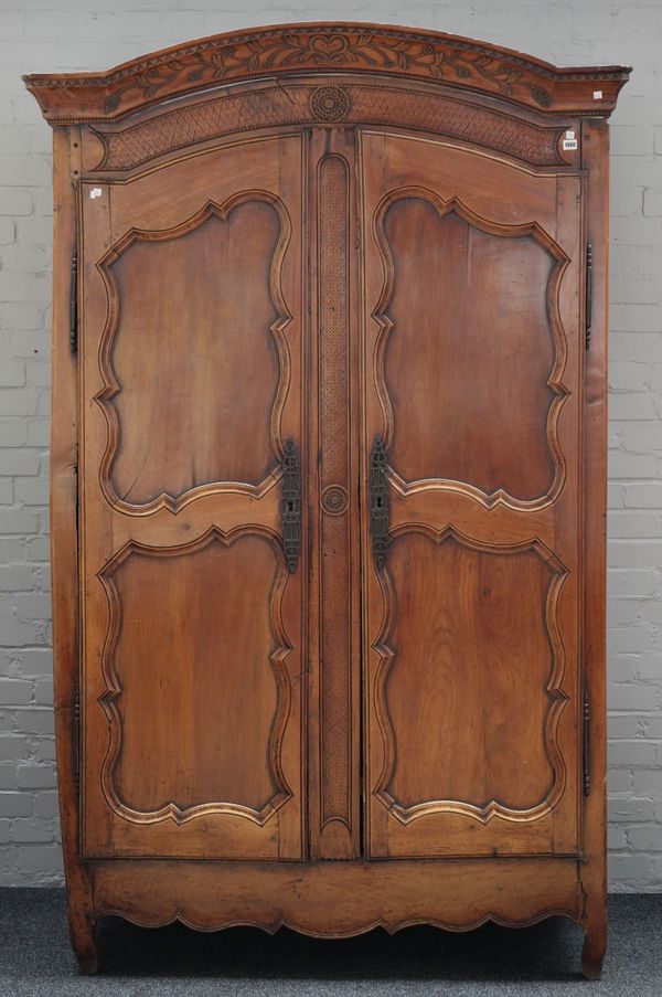 AN 18TH CENTURY FRENCH FRUITWOOD TWO DOOR ARMOIRE