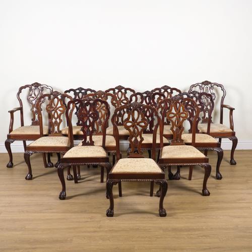 A SET OF TWELVE GEORGE II STYLE MAHOGANY FRAMED DINING CHAIRS (12)