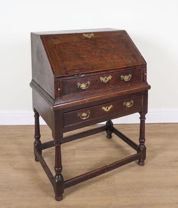 AN 18TH CENTURY OAK BUREAU ON STAND