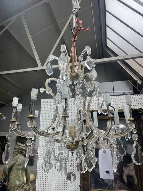 A LOUIS XV STYLE GLASS MOUNTED BRASS TWELVE BRANCH CHANDELIER