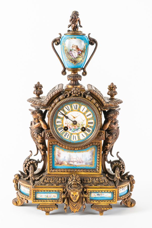 A FRENCH ORMOLU AND PORCELAIN MANTEL CLOCK