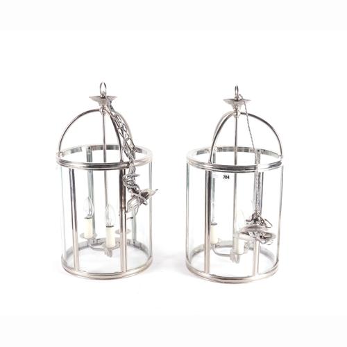 A PAIR OF MODERN CHROME PLATED AND GLASS THREE LIGHT CYLINDRICAL CEILING LANTERNS (2)