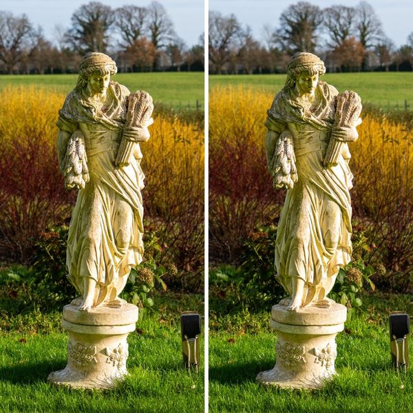 A PAIR OF RECONSTITUTED STONE FIGURES OF FEMALE WHEAT GATHERERS (2)