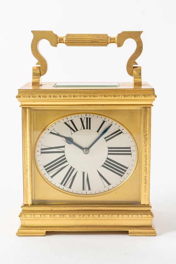 A FRENCH GILT-BRASS CARRIAGE CLOCK WITH ELLIPTICAL DIAL