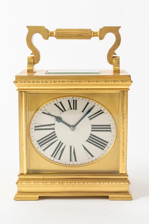 A FRENCH GILT-BRASS CARRIAGE CLOCK WITH ELLIPTICAL DIAL