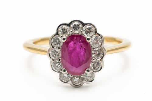 A RUBY AND DIAMOND FLORAL CLUSTER RING