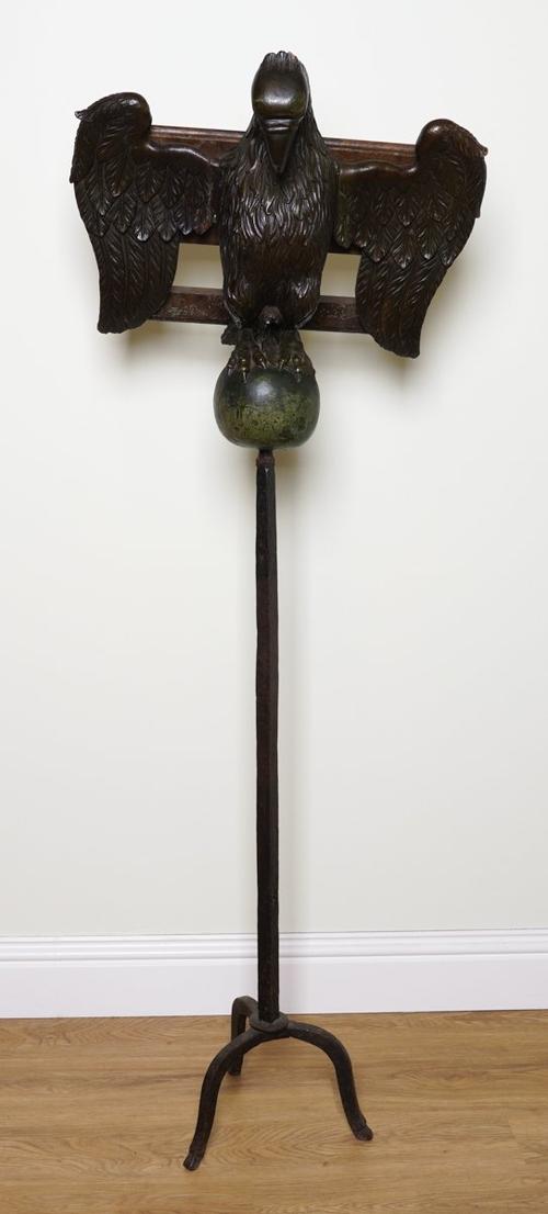 A  NORTH EUROPEAN CARVED AND PAINTED WOOD EAGLE LECTERN