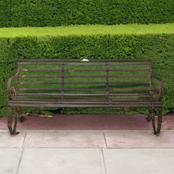 O.TALBOT; A LATE 19TH CENTURY STRAP IRON GARDEN BENCH