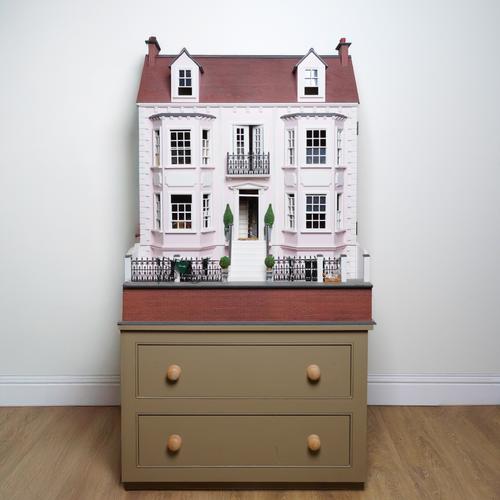 A DOUBLE FRONTED GEORGIAN STYLE PINK DOLL’S HOUSE, KNOWN AS ‘ASHBROOK’, ON CHEST