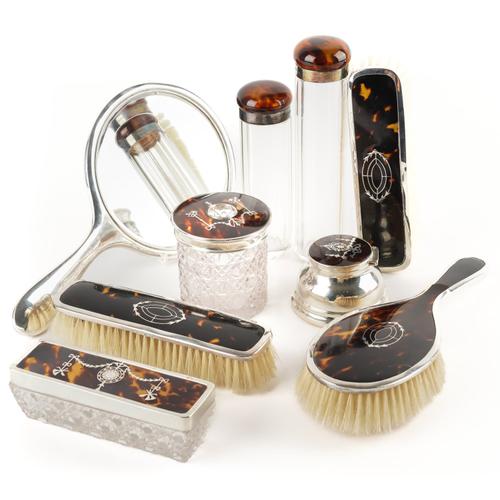 A GROUP OF NINE SILVER MOUNTED TORTOISESHELL DRESSING TABLE WARES (9)