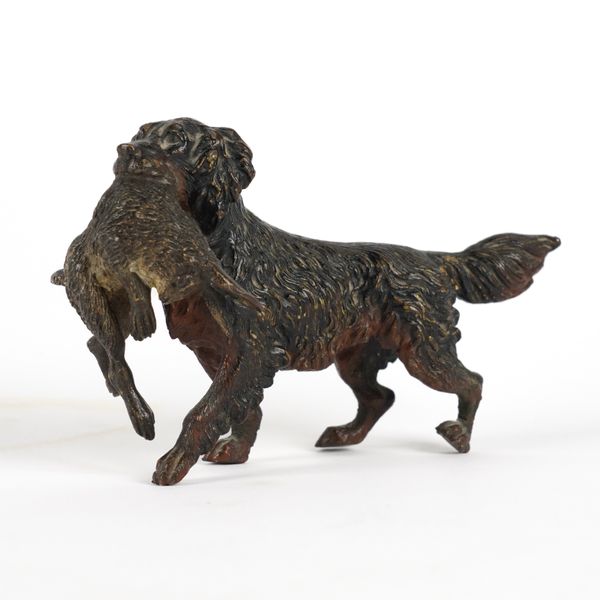 AN AUSTRIAN COLD PAINTED BRONZE MODEL OF A RETRIEVER WITH A HARE