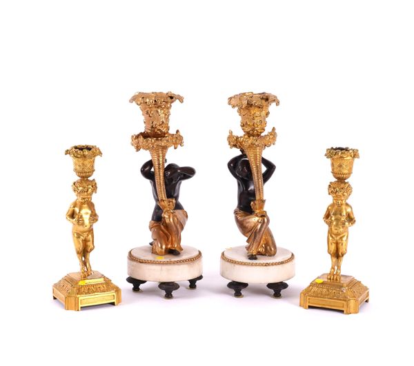 TWO PAIRS OF FRENCH LOUIS XVI STYLE GILT-BRONZE CANDLESTICKS (4)