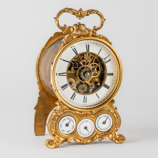 AN UNUSUAL FRENCH GILT BRASS STRIKING CALENDAR SKELELTONISED MANTEL CLOCK WITH DUPLEX ESCAPEMENT AND ALARM