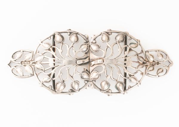 A SILVER TWO PIECE WAISTBELT BUCKLE