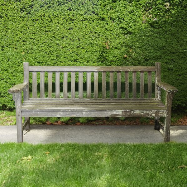 BARLOW TYRIE; A SLATTED HARDWOOD GARDEN BENCH