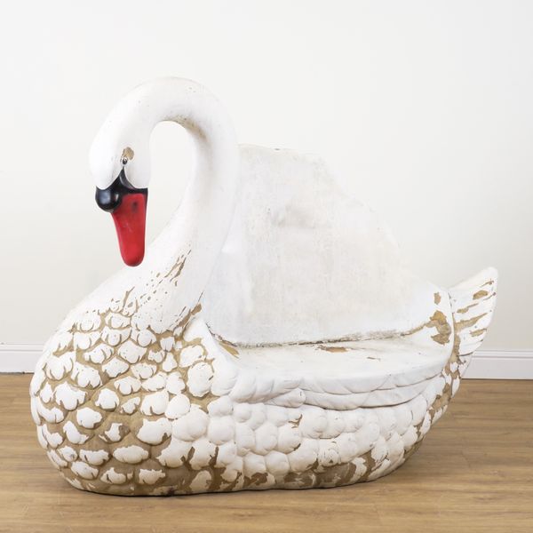 A FIBRE GLASS GARDEN BENCH FORMED AS A SWAN