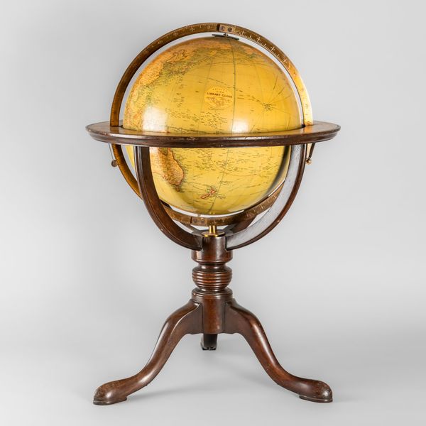 A GEORGE III STYLE 12INCH LIBRARY GLOBE ON A MAHOGANY TRIPOD STAND