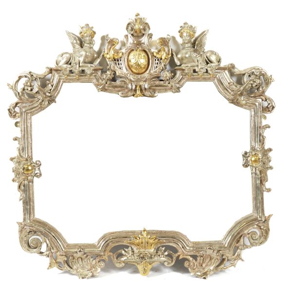 A 19TH CENTURY SILVER AND PARCEL GILT FRAMED SHAPED MIRROR