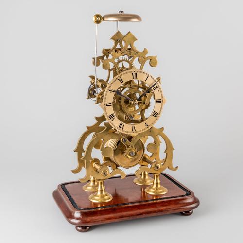 A VICTORIAN BRASS SKELETON TIMEPIECE WITH ONE-IN-PASSING STRIKE
