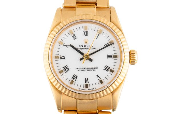 A ROLEX OYSTER PERPETUAL 18CT GOLD REF 67518 WATCH