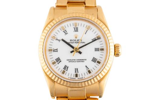A ROLEX OYSTER PERPETUAL 18CT GOLD REF 67518 WATCH