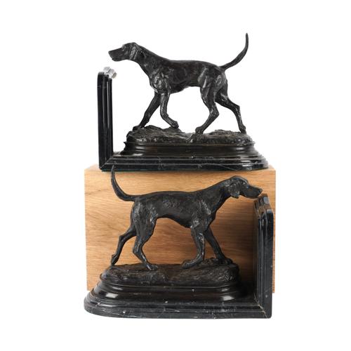 A PAIR OF BRONZE MOUNTED BLACK FOSSIL MARBLE BOOK ENDS MODELLED AS HUNTING DOGS (2)