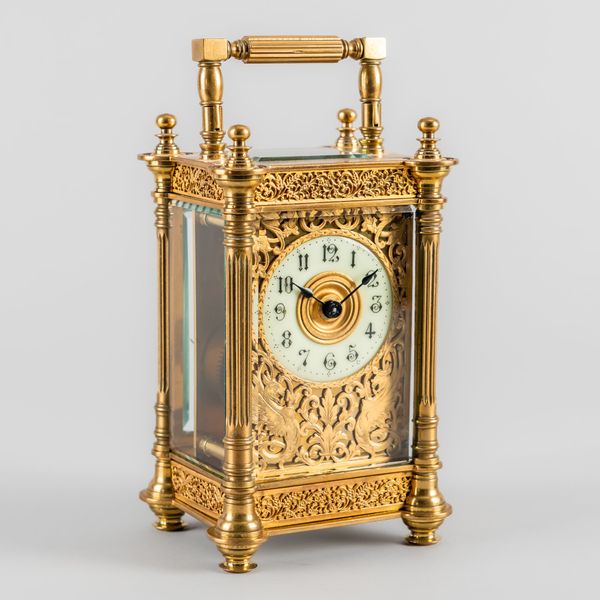 A FRENCH BRASS CARRIAGE TIMEPIECE