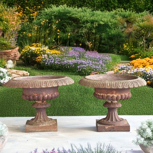 A PAIR OF LATE 19TH CENTURY CAST IRON GARDEN URNS (2)